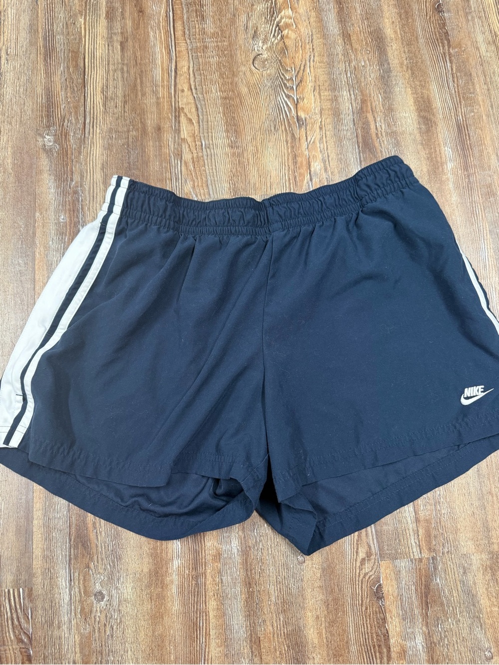 Vintage Y2K Nike navy blue shorts with white stripes on sides, size L